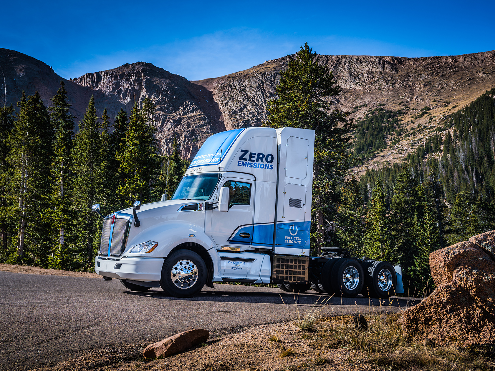 Kenworth T680 electric parked in front of mountain